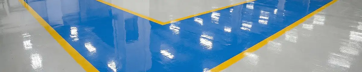 A factory floor professionally covered and marked with epoxy flooring in Arlington, TX