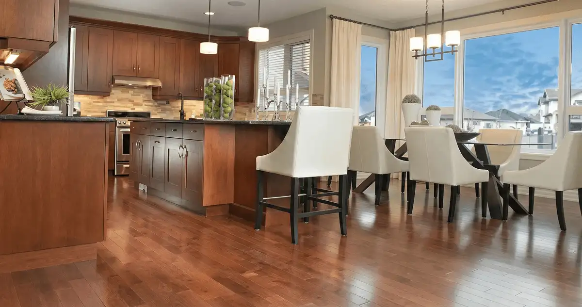 A modern kitchen with professionally installed wood flooring in Arlington, TX