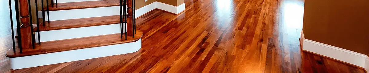 Base floor of a staircase with professionally restored wood flooring in Arlington TX