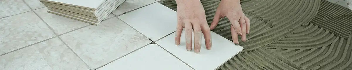 Professional installing white tile floors in Arlington, TX