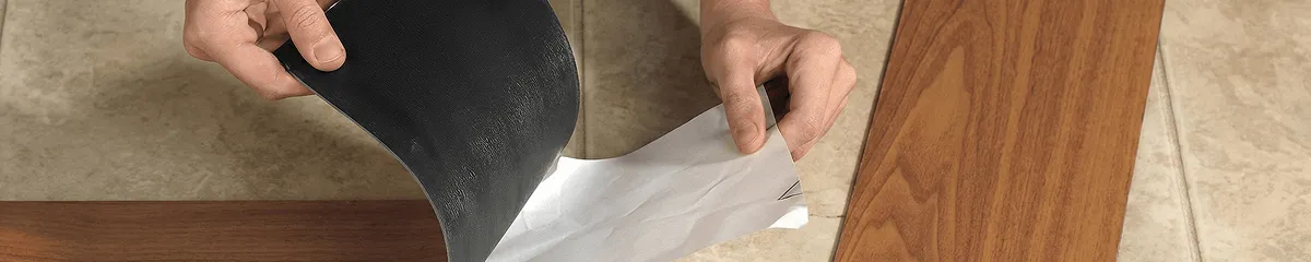 A professional installing vinyl flooring in Arlington, TX