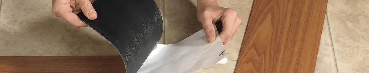 A professional installing vinyl flooring in Arlington, TX