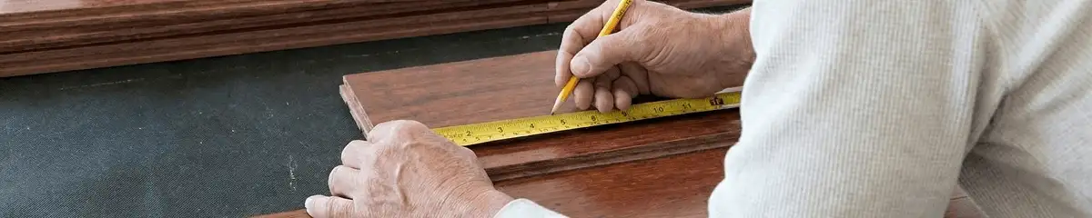 A professional installing wood flooring in Arlington, TX